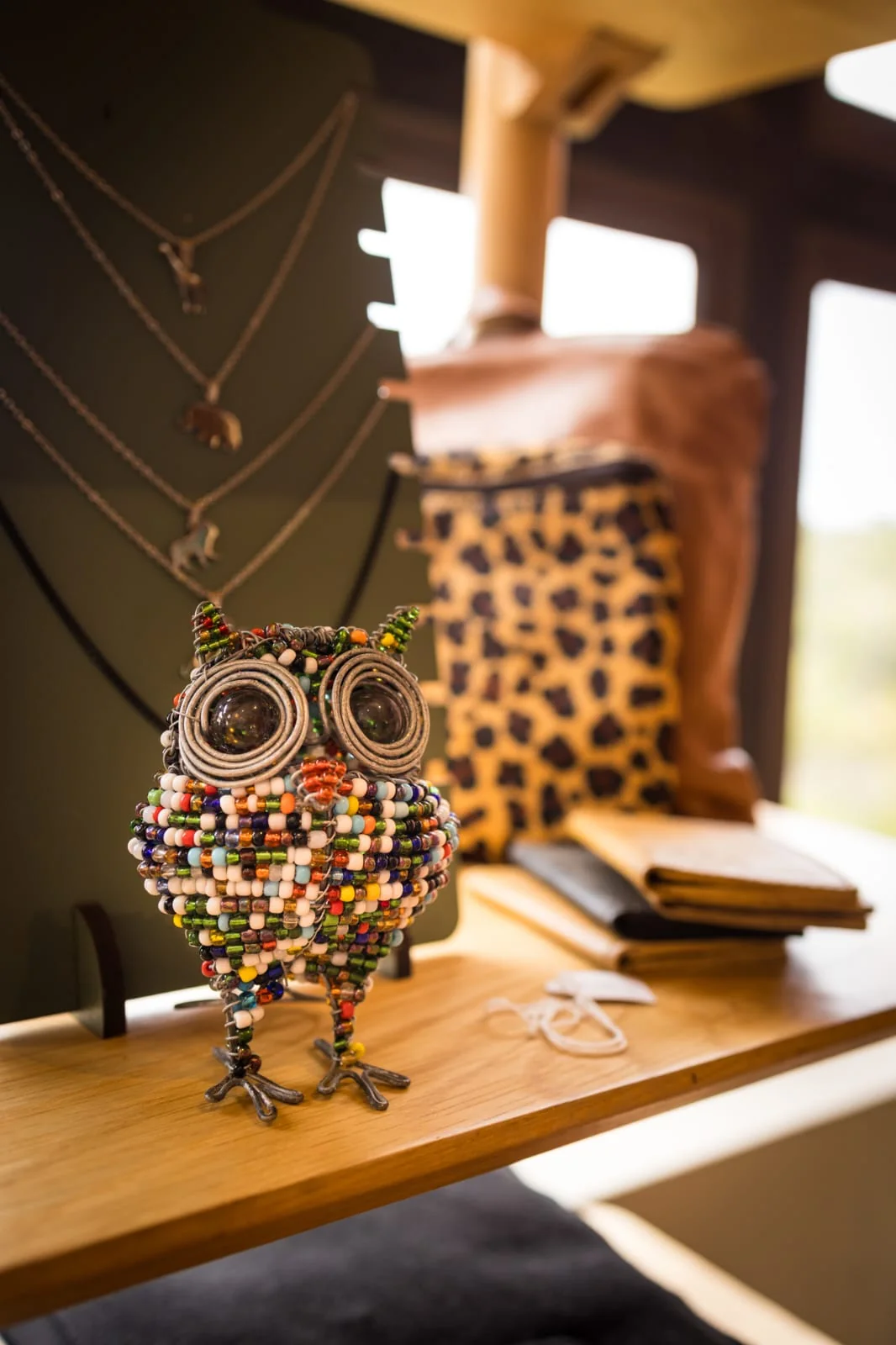 Lodge room detail with handcrafted owl and safari styling