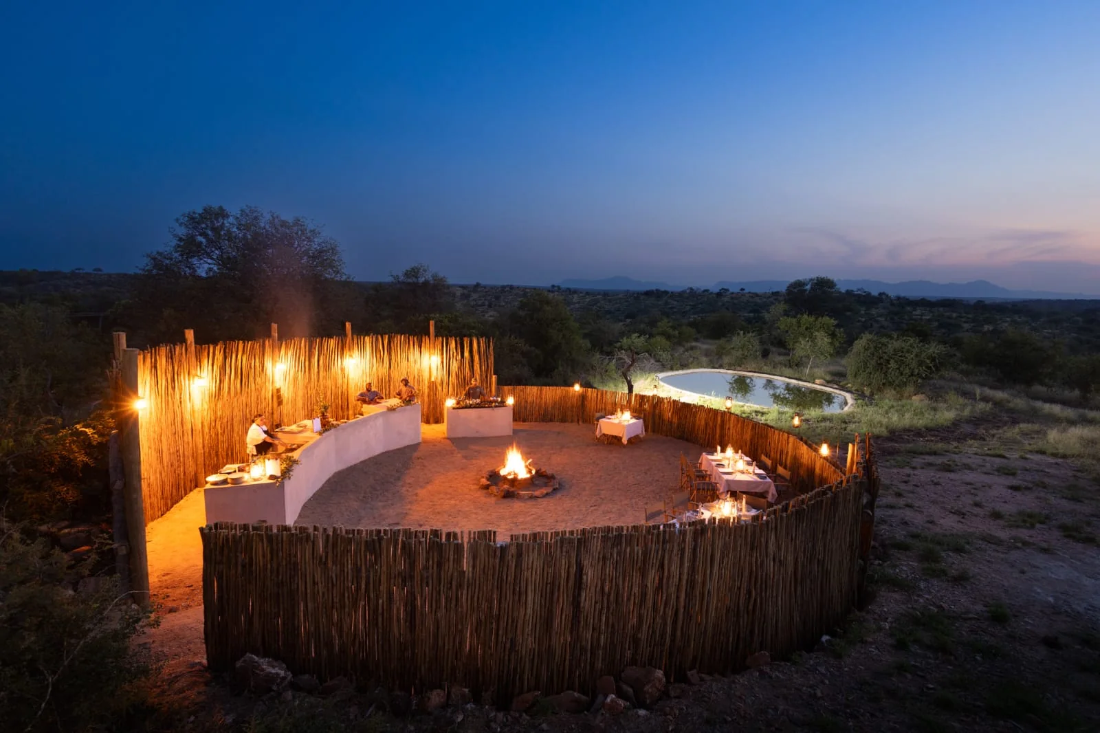 Boma dinner setup beside the lodge waterhole