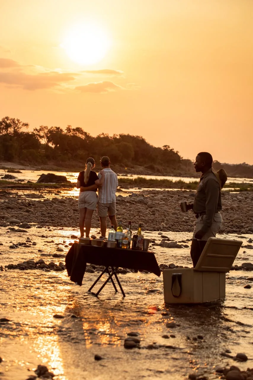 People at a sunset river setup